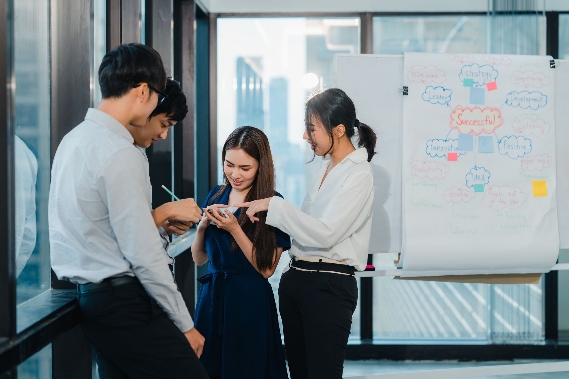 A multidisciplinary team of professionals collaborating in a creative office